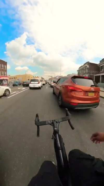 Cyclist Sideswipes Someone&rsquo;s Car in Traffic 🤡 