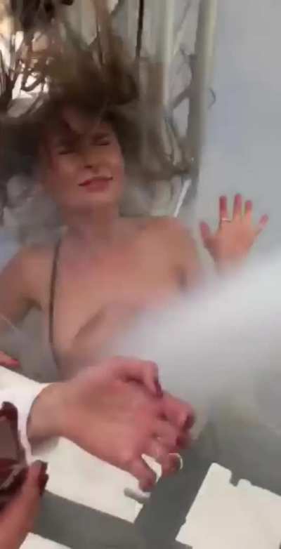 Party girl has her top blown off, nude tits exposed