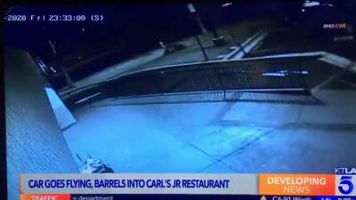 Collision between 2 cars sends one flying towards a Carl&rsquo;s Jr.