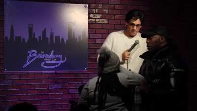 Heckler calls comedian a racist.