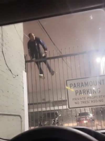 Guy in car watching someone try to flee