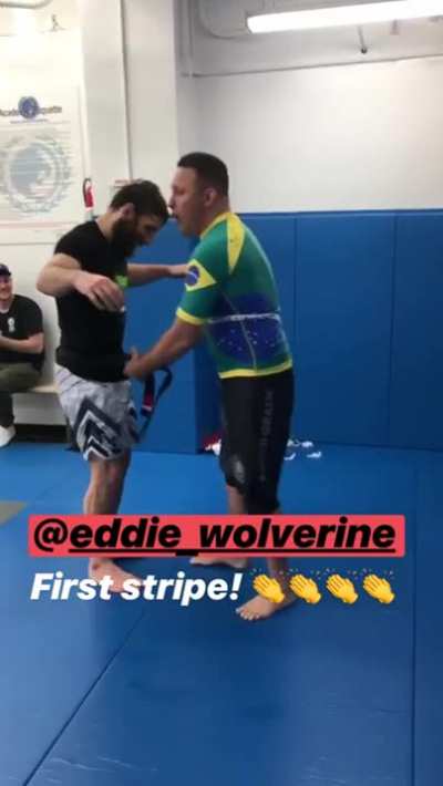 Eddie Cummings getting a stripe from Renzo Gracie (video from Ottavia Bourdain's instagram story)