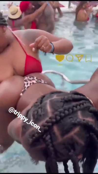 Hot lesbian couple humping at a pool party