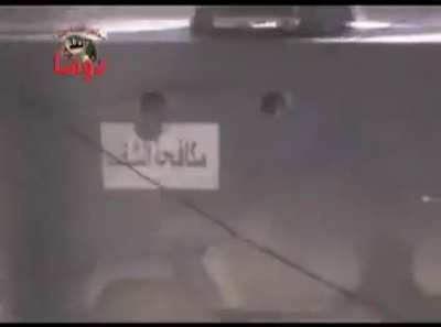 Syrian Army armored car loaded with soldiers repeatedly pops out to exchange fire with Opposition fighters - 3/9/2012
