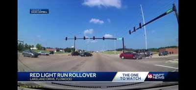 SUV hit by car that ran a red light