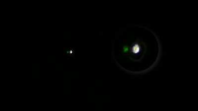 Green light caught next to star. Other objects for comparison.