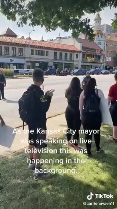“There’s a police officer with their knee on someone’s back right now!”