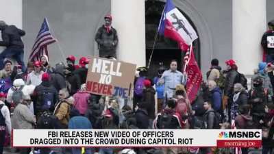 FBI Releases New Video Of Officers Dragged Into Crowd During Capitol Riot