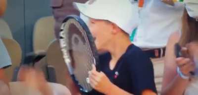 This kid&rsquo;s reaction on getting racket from Novak Djokovic after historic French Open win today
