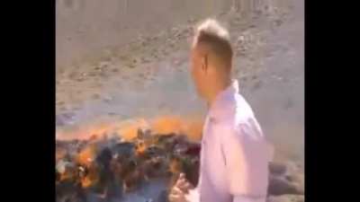 BBC reporter struggles to maintain composure after inhaling fumes from burning narcotics.