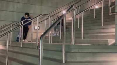 My friend headbutting a rail