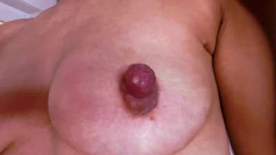 My long thick nipples are finally getting milky