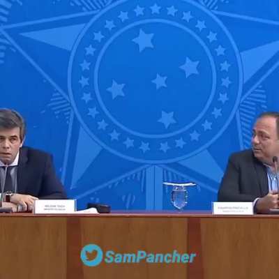 Ministro da Sa&uacute;de sendo informado pela imprensa de que o Presidente definiu sal&atilde;o de cabeleireiros e a academia como servi&ccedil;o essencial