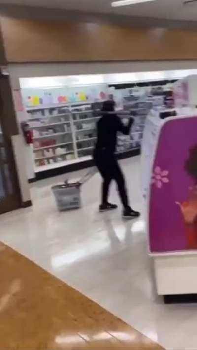 Woman with pick axe threatens customers and employees while she robs a CVS in Venice Beach