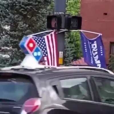 Monohanded topless nazi cracking whip on street corner.