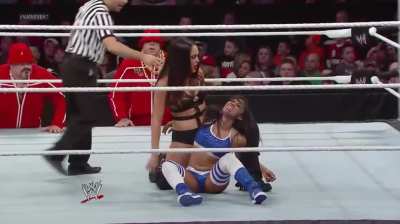 Nikki Bella putting Cameron in a painful hold