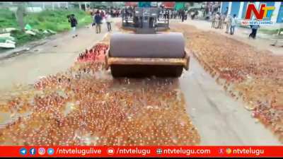 Police smashing 63000 illegal liquor bottles in Indian state of Andhra Pradesh