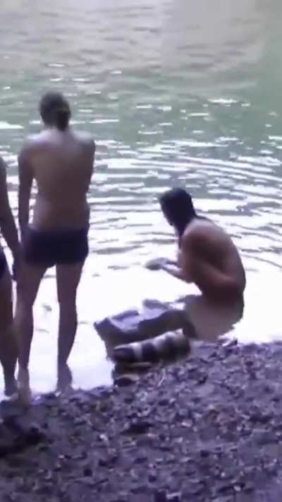 A cute, petite Asian woman hikes the mountains completely naked. Tourists don't bother her. She swims in the river, climbs trees, and walks along trails.