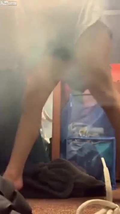 College girl lights fireworks in dorm room only to find out instantly why it's typically an outdoor activity