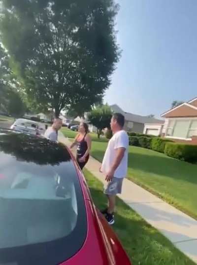 Off duty NYPD officer sits on man&rsquo;s car and refuses to move as wife tries to reason with him