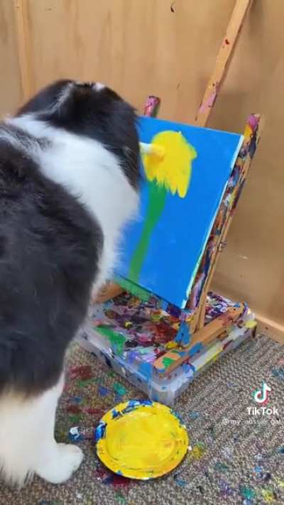 Doggo paints a beautiful flower!