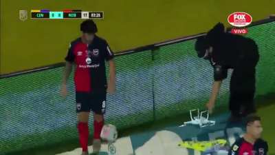 Newell's Old Boys player Pablo Pérez destroys a drone that carries a banner mocking his team.