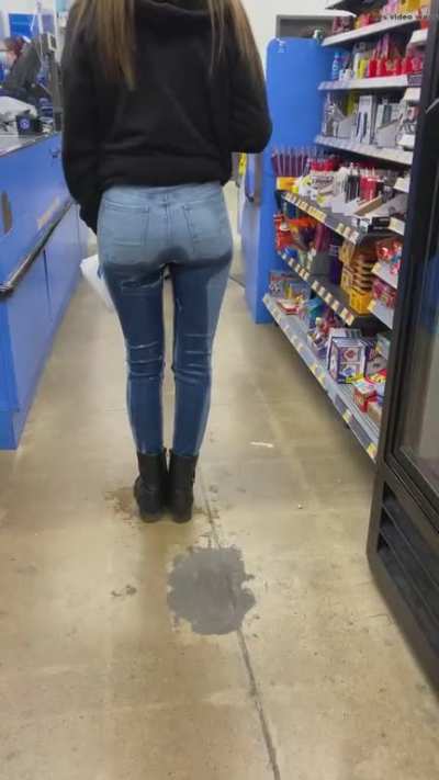 Girl pees her jeans waiting in line.