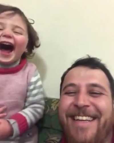 Syrian father plays "guess what's the next explosion?" with his daughter to minimize the mental damage it can do to her.