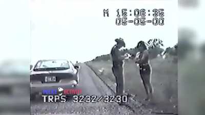 Cop asks lady to move out of the way so she doesn't get hit