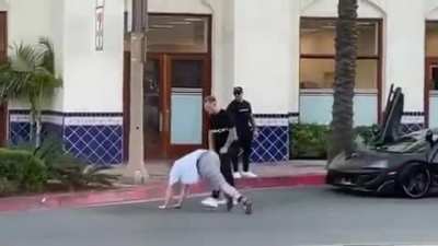 Drunk guy sits on McLaren, has a bad time - Huntington Beach, CA