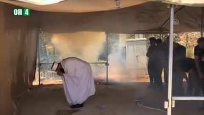 Israeli police breaking up a peaceful muslim prayer with teargas