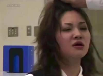 Jap Fights Off Tears Whule Enduring A Barrage of Slaps