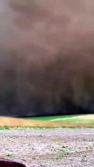 A tornado touches down close to a couple of guys fishing