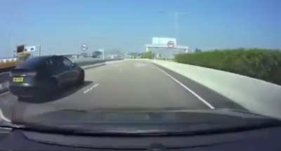 Tesla Model 3 races into a one lane construction zone