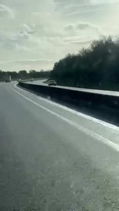 Old woman drives for several minutes on wrong side of motorway.