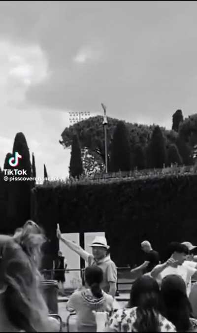 What are the people doing at the tower of Pisa?