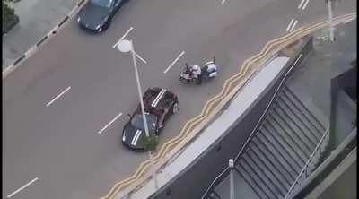 Supercars circling fountain at Suntec City