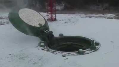 A Rocket getting launched out of a missile silo. (Turn down your volume)