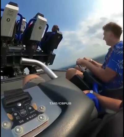 Guy shutting down on rollercoaster ride