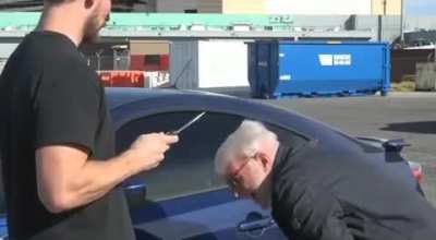 Cummins holding the camera