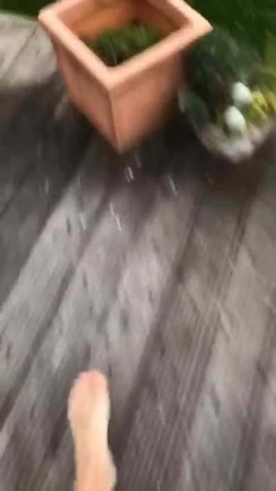 Me and my parents getting ambushed by a hail storm in the middle of a beautiful summer day