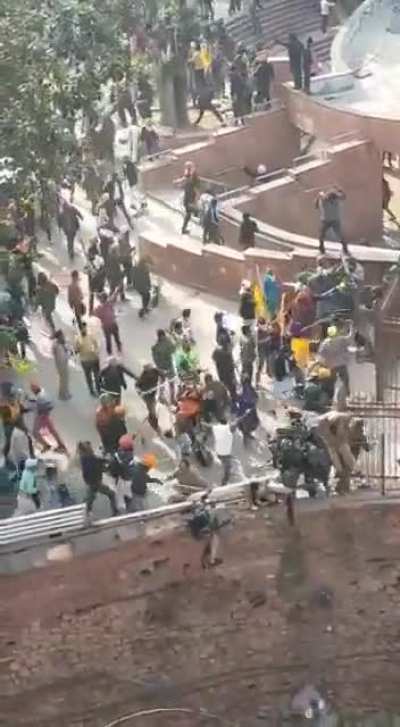 Farmers helping cops to come down from parapet where they were stuck for hours.
