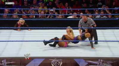 Layla uses her muscular legs to weaken the thin abdomen of the blonde Barbie doll