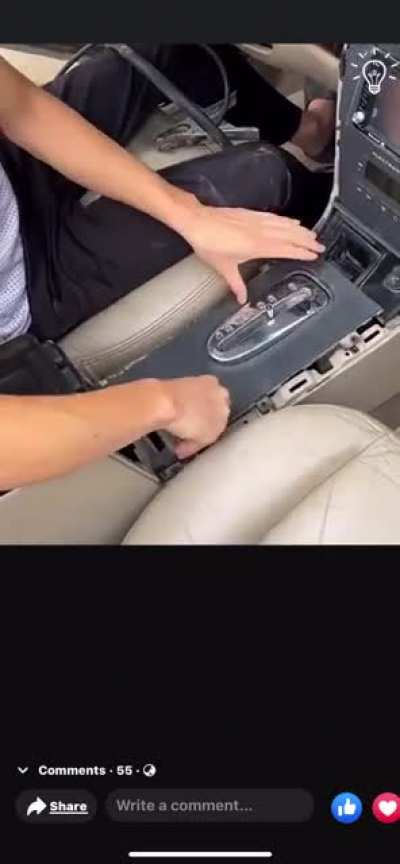 A man fixes his car&rsquo;s transmission