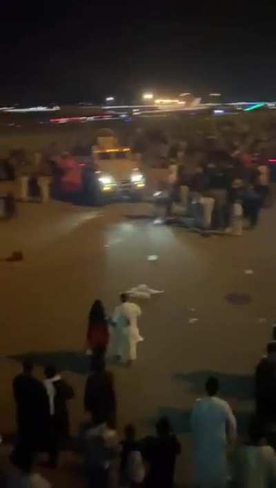 Thousands of civilians try to get an evacuation flight on the tarmac of Kabul airport in Afghanistan, all while Taliban forces are slowly seizing the airport