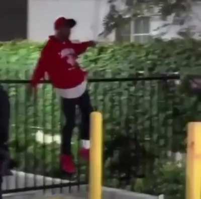 WCGW climbing over a pointy fence