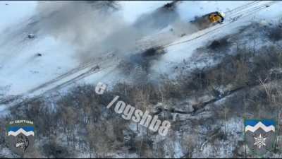 A Ukrainian soldier blows up a Russian armored vehicle with the help of a grenade launcher from a close range