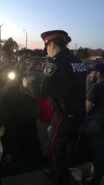 Canadian Police Officer Inciting a Crowd
