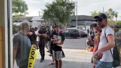 Anti-Vaxxers protesting outside a Trader Joes in Los Angeles this Friday