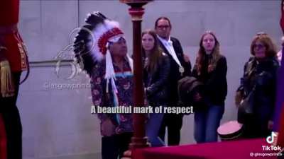 A Canadian First Nations Chief saluting the Queen of Canada&rsquo;s coffin